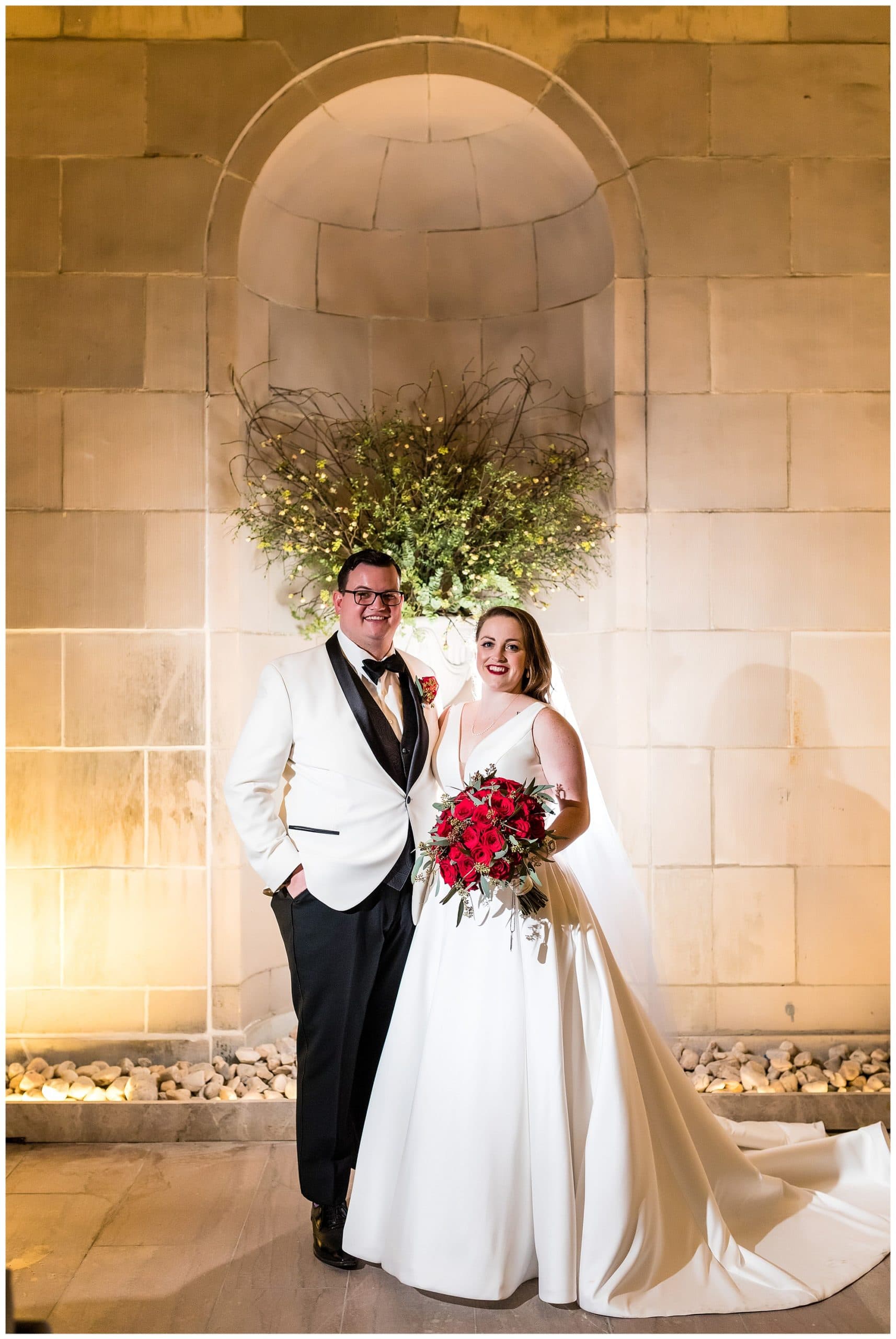 Night time portrait of bride and groom on outside terrace at the Ballroom at the Ben