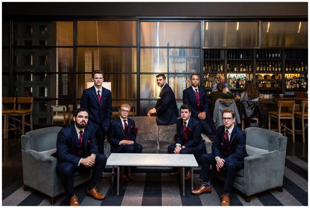 Serious groomsmen portrait in Loews Philadelphia bar