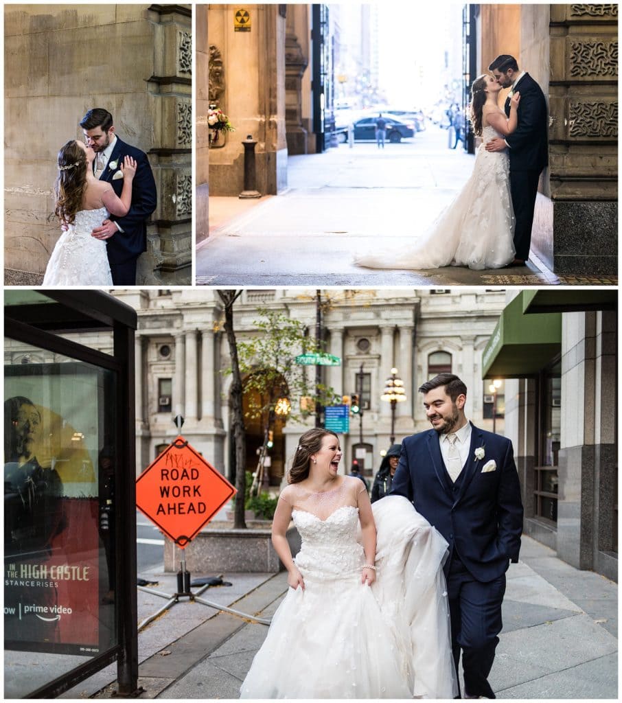Bride and groom kiss in tunnels of Philadelphia City Hall, groom holding brides dress as they walk through the city
