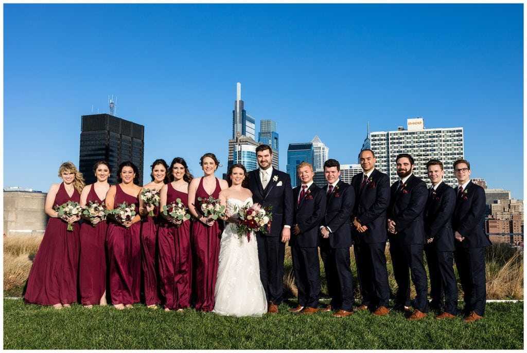 Wedding party portrait in front of Philadelphia skyline
