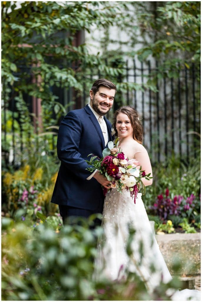 Traditional bride and groom portrait in Philadelphia City Hall gardens