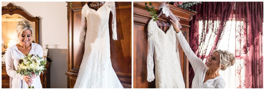 Bride holding her bouquet and hanging gown with custom mrs hanger