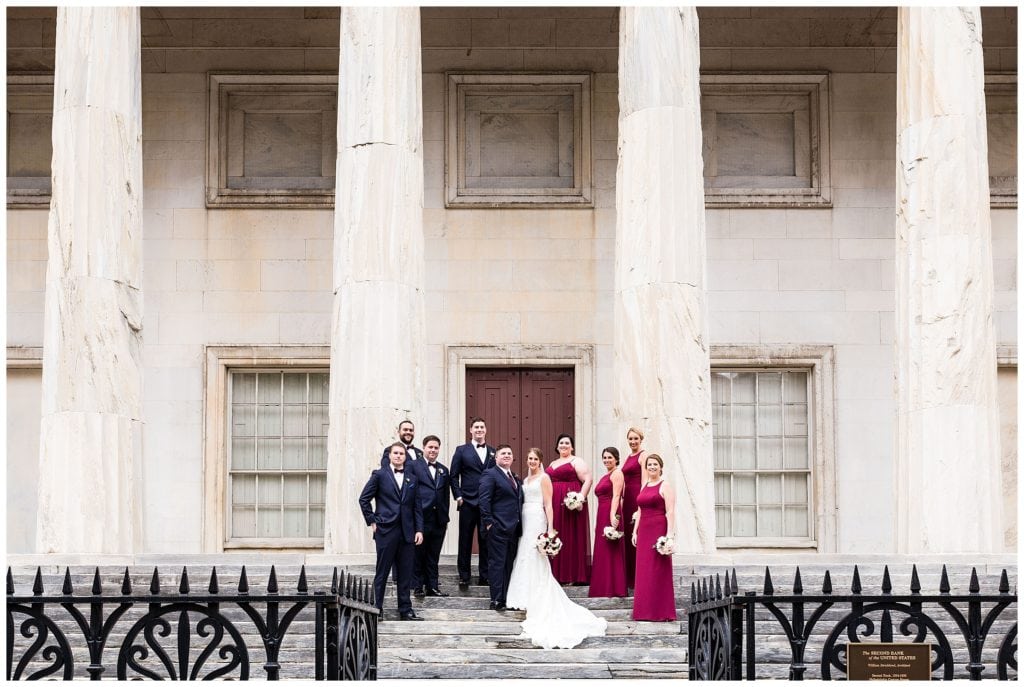 Wedding party portrait on steps at Second National Bank in Philadelphia