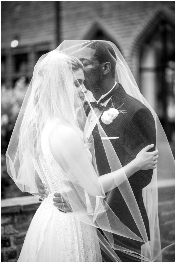 Traditional black and white bride and groom portrait under veil at Aldie Mansion wedding