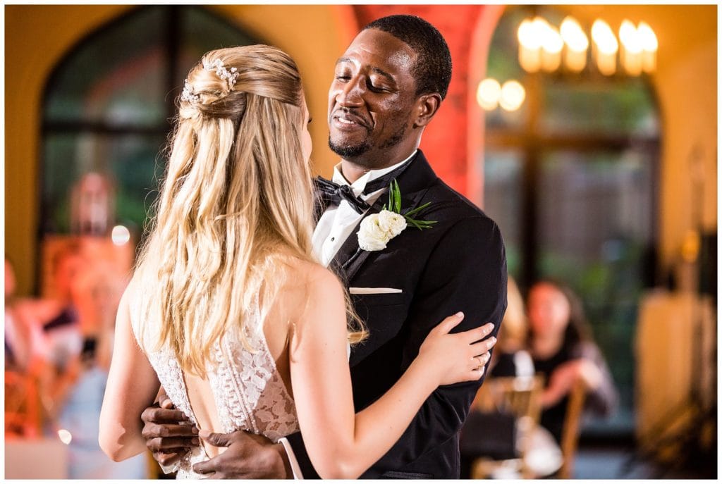 Groom smiling at bride during first dance at Aldie Mansion wedding reception