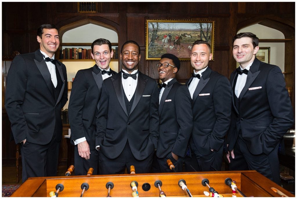 Groomsmen portrait with foosball table after getting ready at Aldie Mansion wedding