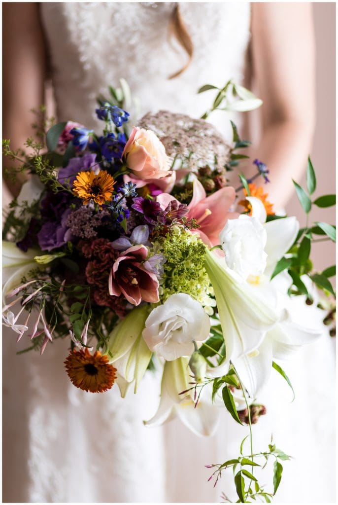 Bride holding colorful bridal bouquet