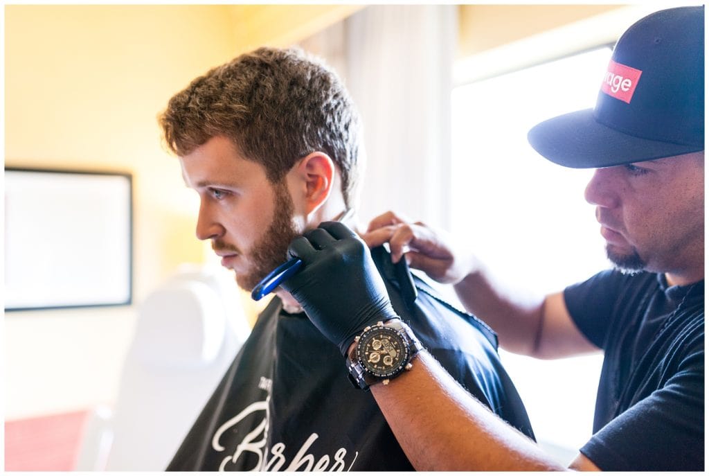 Groom getting shaved prep portrait