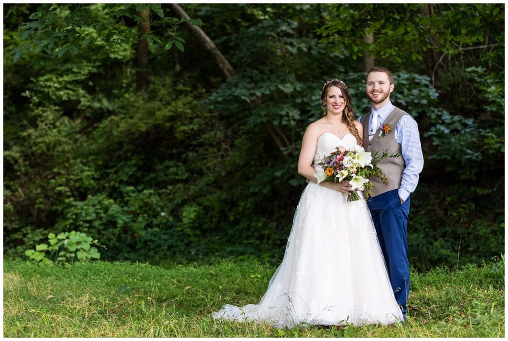 Traditional bride and groom portrait in field