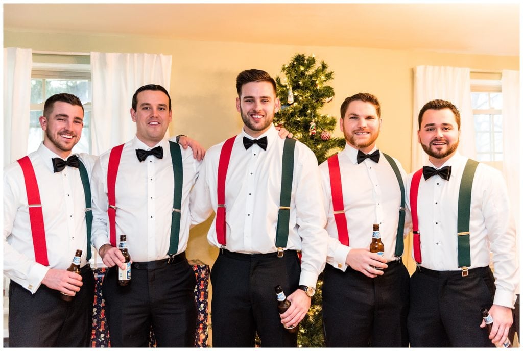 Groomsmen with red and green Christmas suspenders