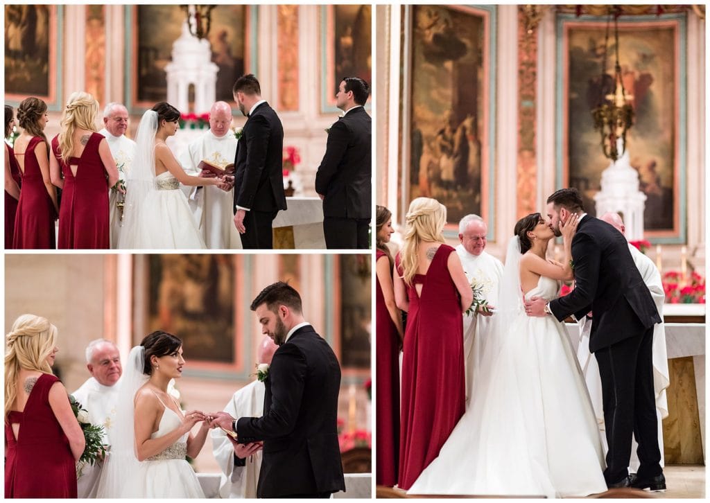 Bride and groom exchange rings and first kiss during St. Charles Boromeo Church Christmas wedding ceremony