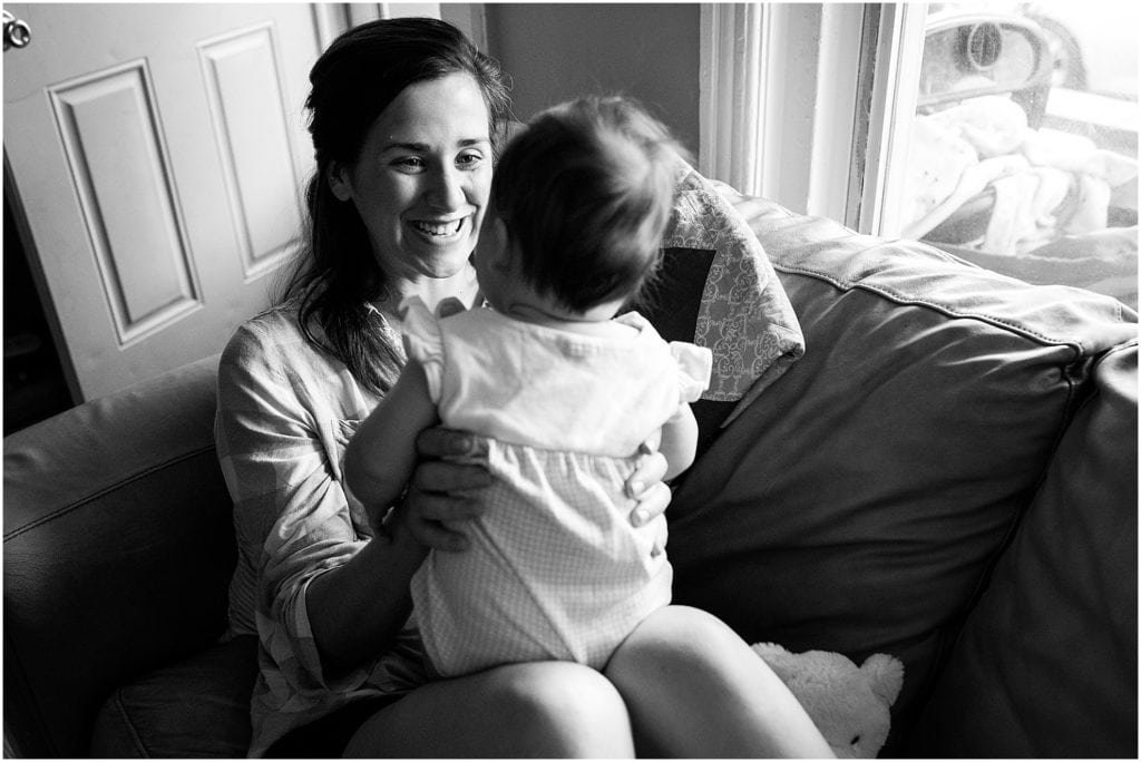 mother smiling at her baby girl, day in the life session