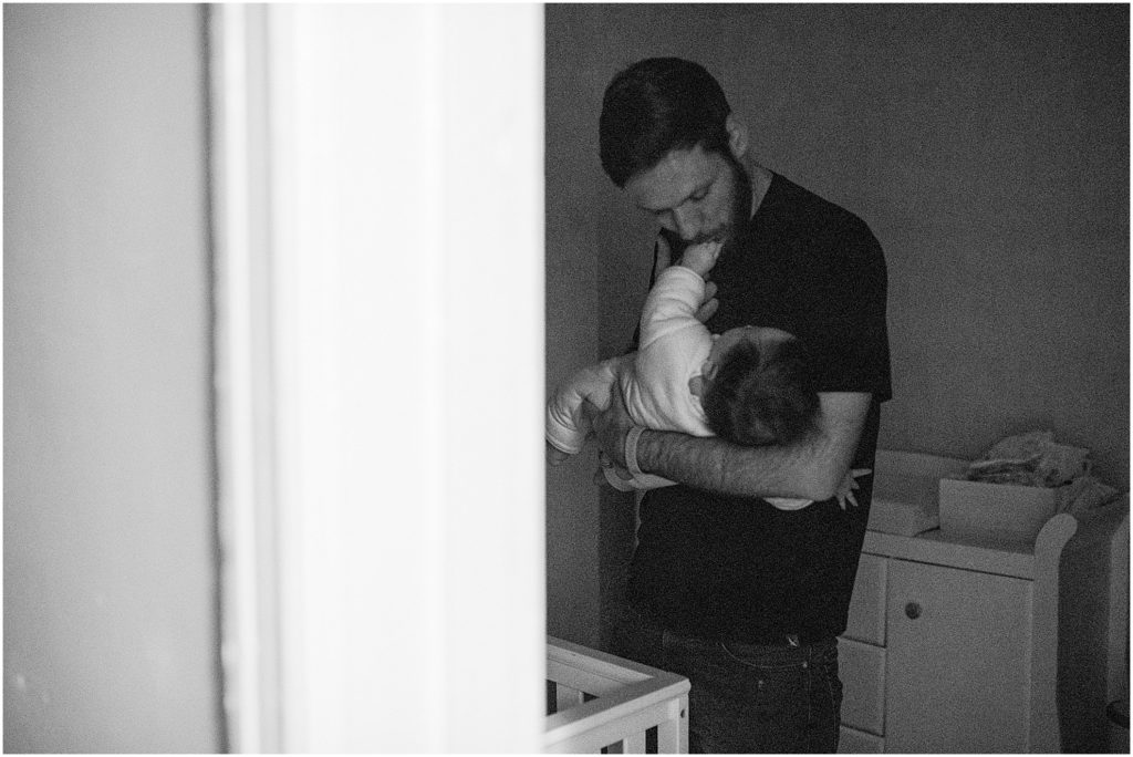 dad sings a lullaby to his baby girl, day in the life family session