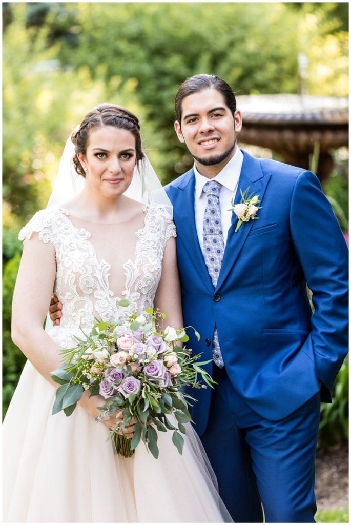 Traditional bride and groom wedding portrait in gardens