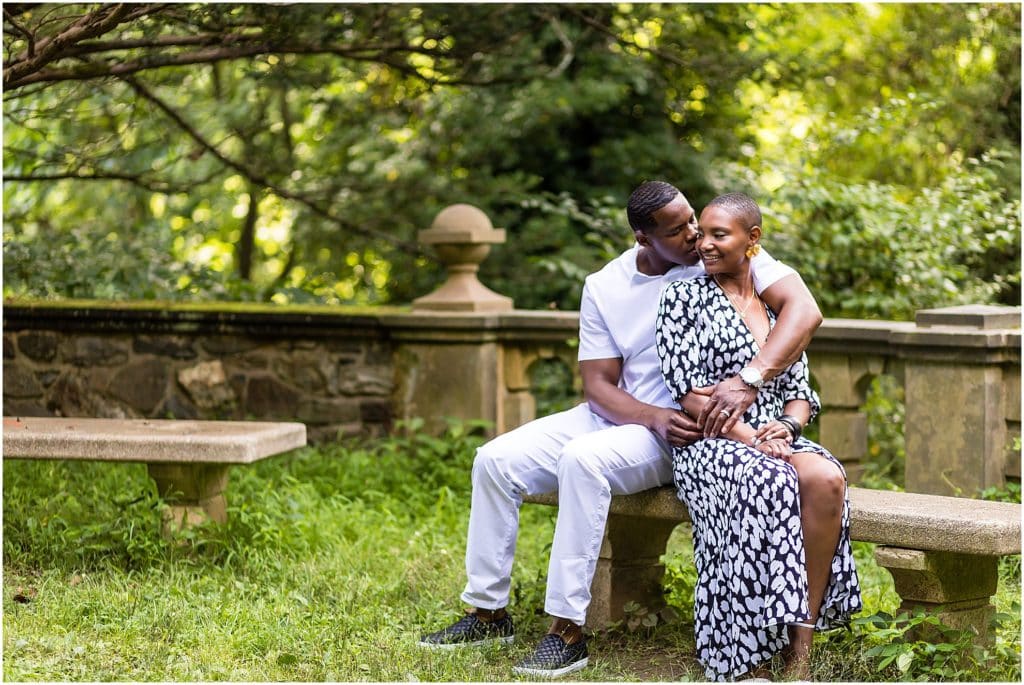 Couple sitting on stone bench in garden at Hunting Hill Mansion at Ridley Creek State Park