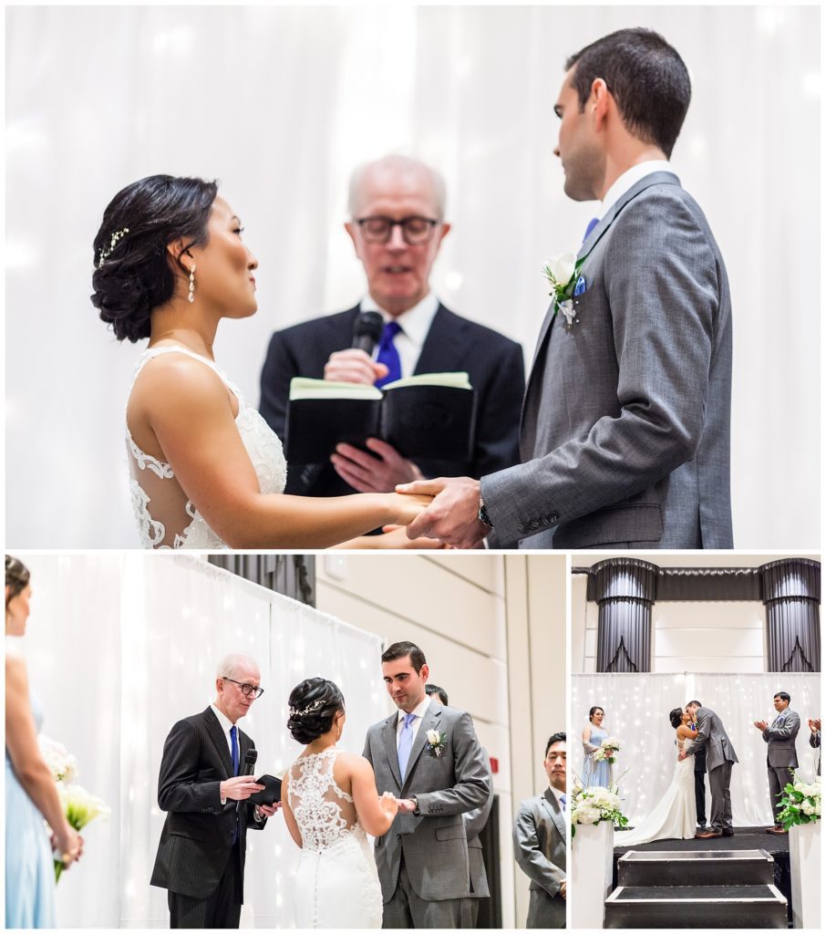 Bride and groom exchanging vows and first kiss at Loews Philadelphia wedding ceremony