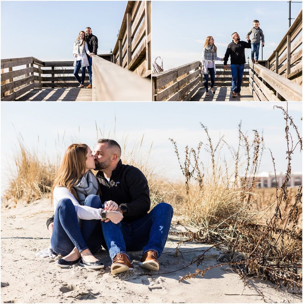 Couple walks with son on boardwalk and sit in the sand at Ocean City New Jersey Beach engagement session