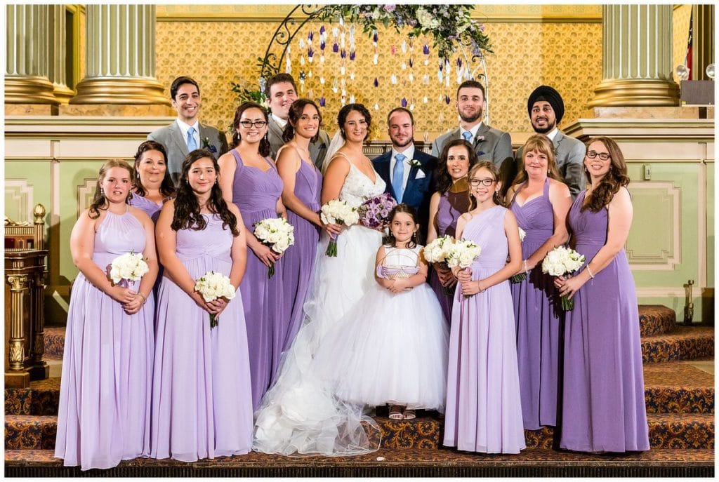 Traditional wedding party portrait under paper crane arch at One North Broad wedding ceremony