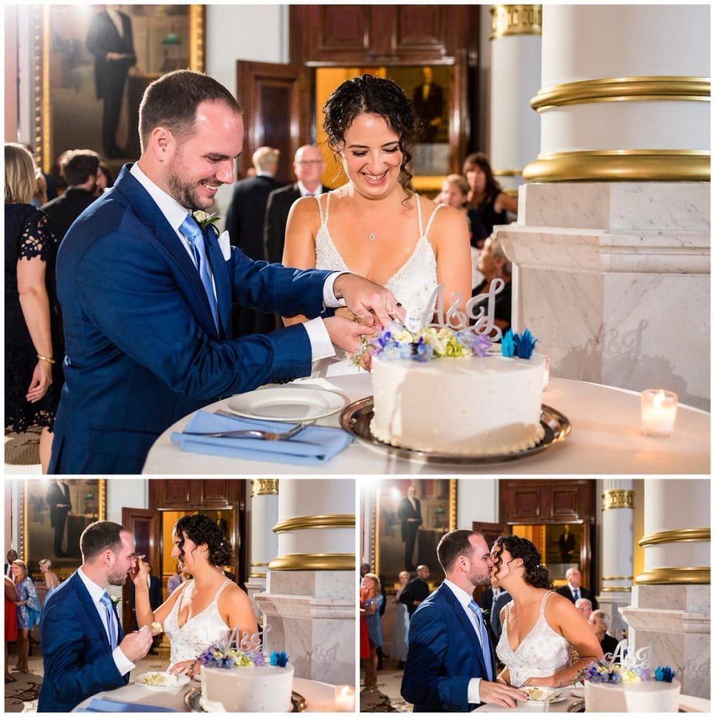 Bride and groom cut cake, bride and groom feed each other cake and kiss at One North Broad wedding reception