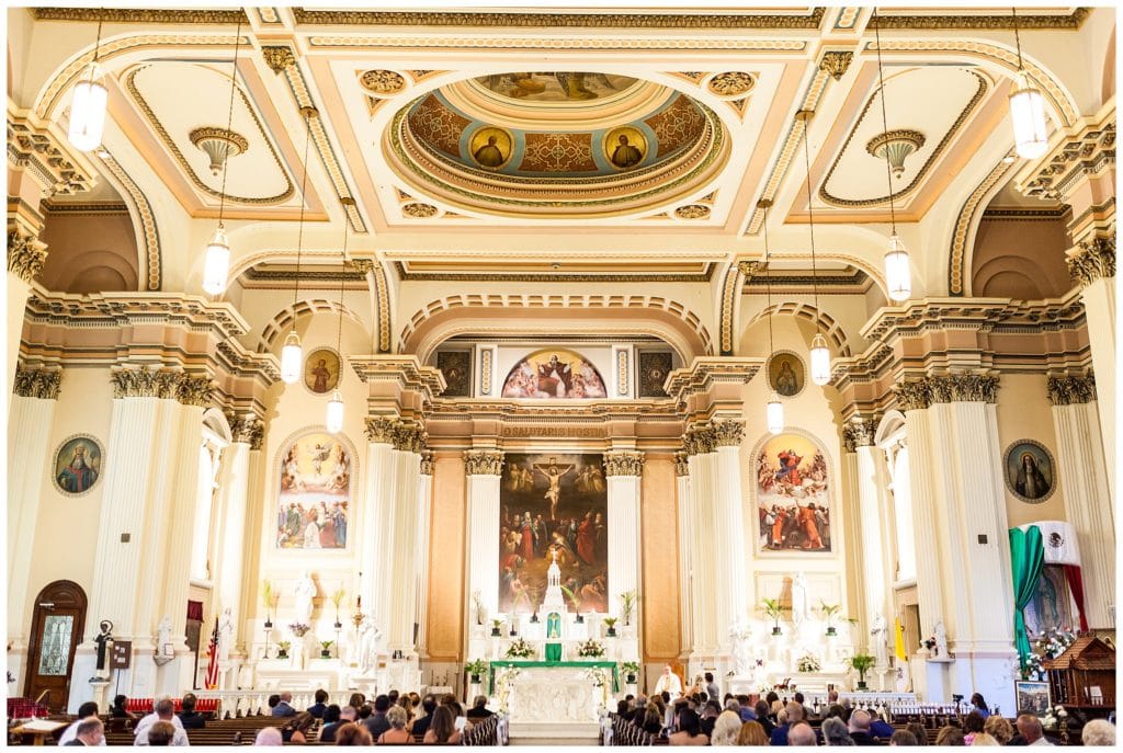 Alter and ceiling art of St. Thomas Aquinas church wedding ceremony