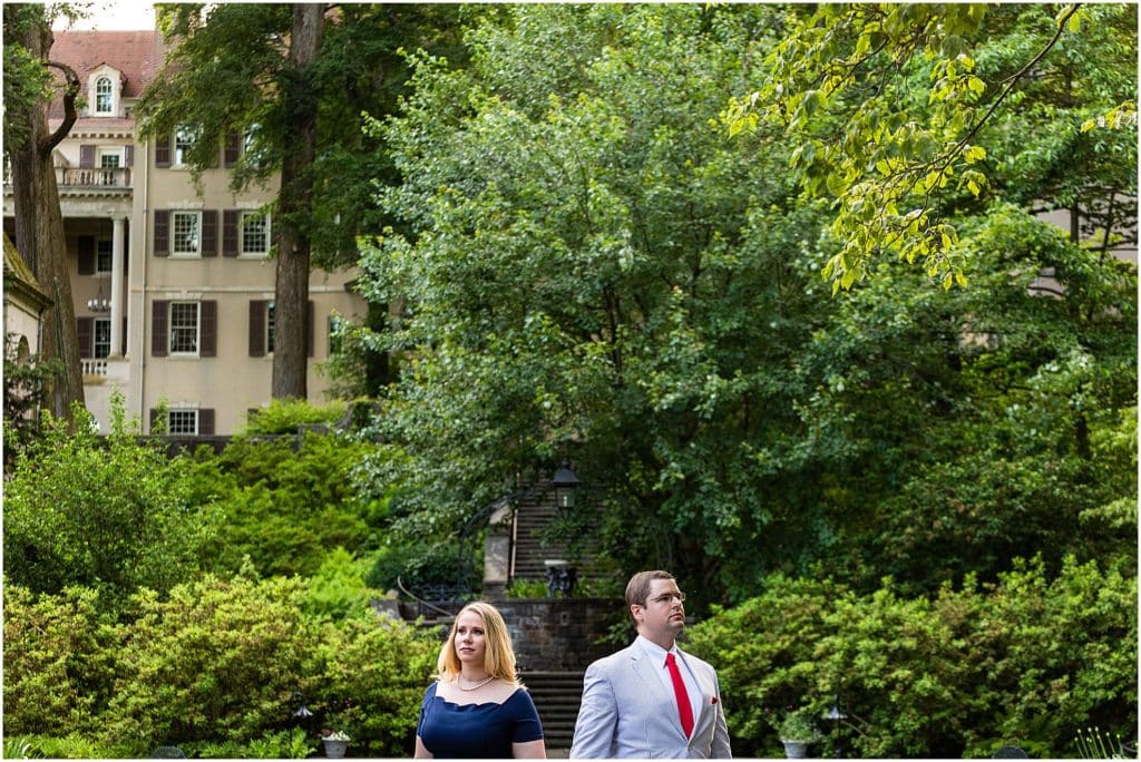 Serious couple engagement portrait in garden at Winterthur