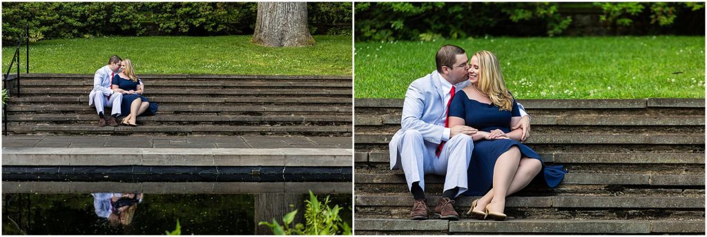 Couple sitting and embracing on stone stairs at Winterthur engagement session