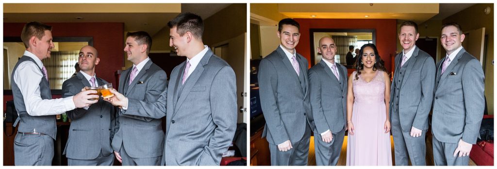 Groomsmen toasting whiskey with groom