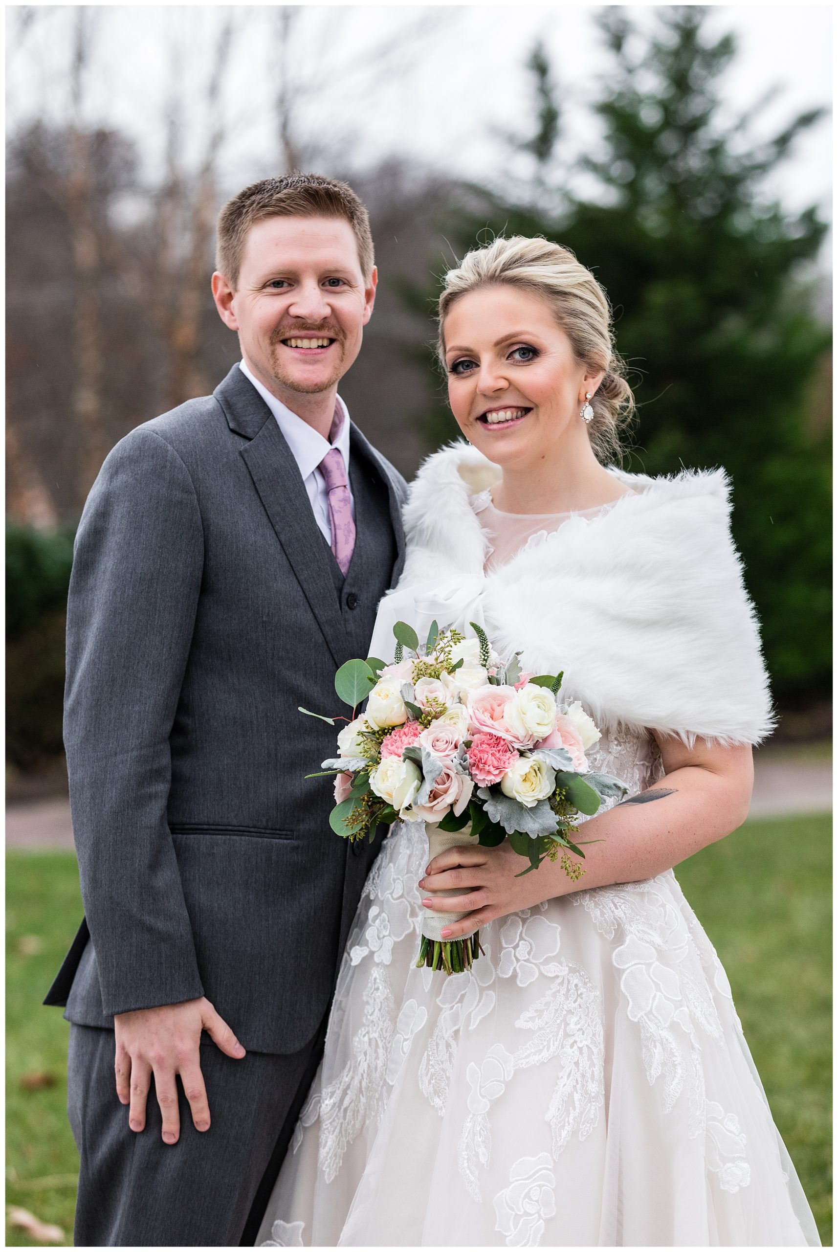 Traditional bride and groom winter wedding portrait