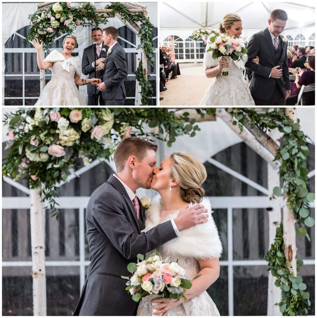 Bride and groom exchange rings, kiss, and walk up aisle at Barn on Bridge holiday wedding ceremony