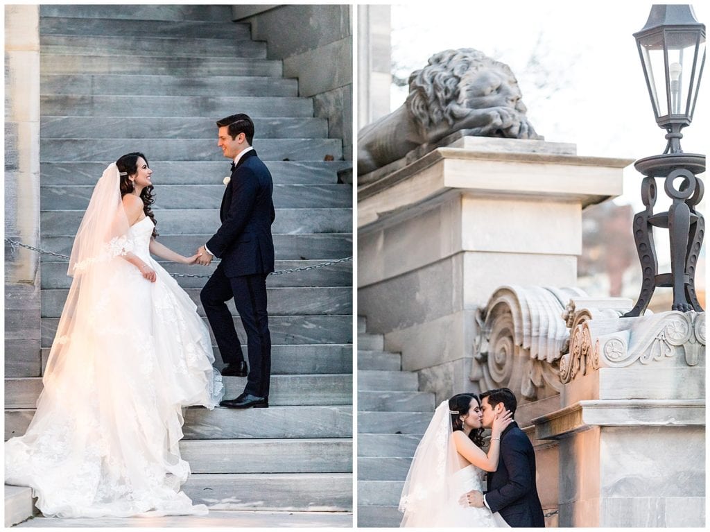 Bride and groom walk and kiss on stairs at sunset at the Merchant Exchange Building