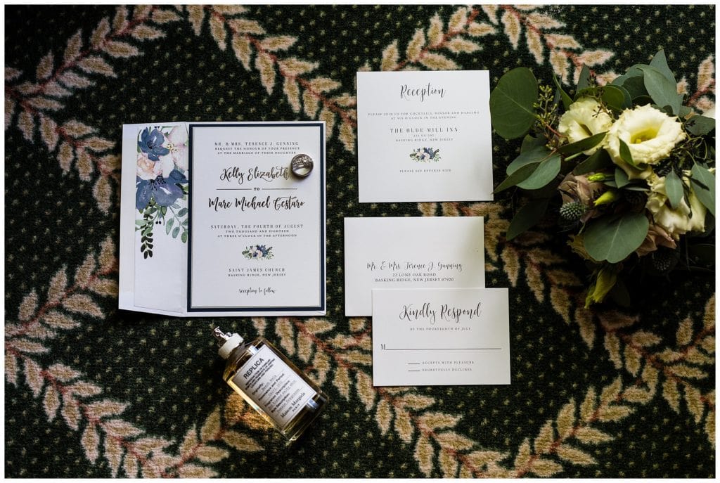 Watercolor floral invitation suite with bouquet and perfume details