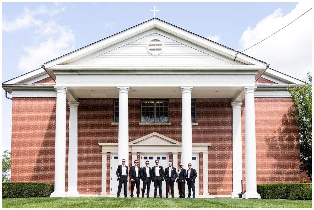 Cool groomsmen in sunglasses portrait outside St. James Church