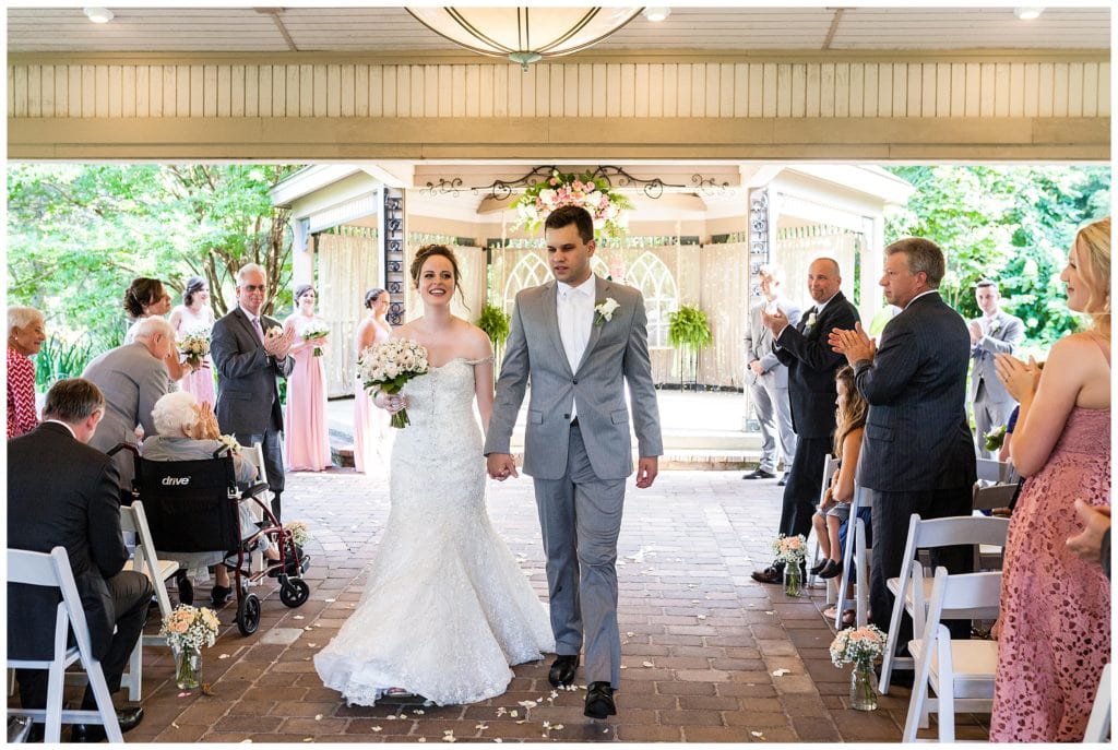 Bride and groom walk up aisle after wedding ceremony at Scotland Run