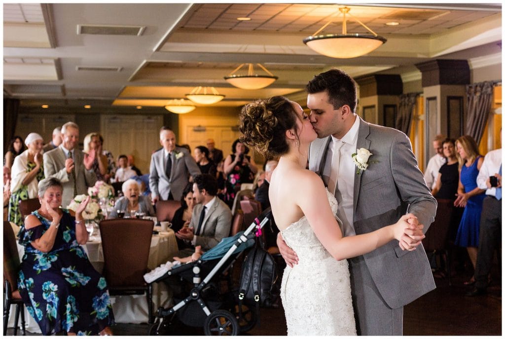 Bride and groom kiss during first dance at Scotland Run wedding reception