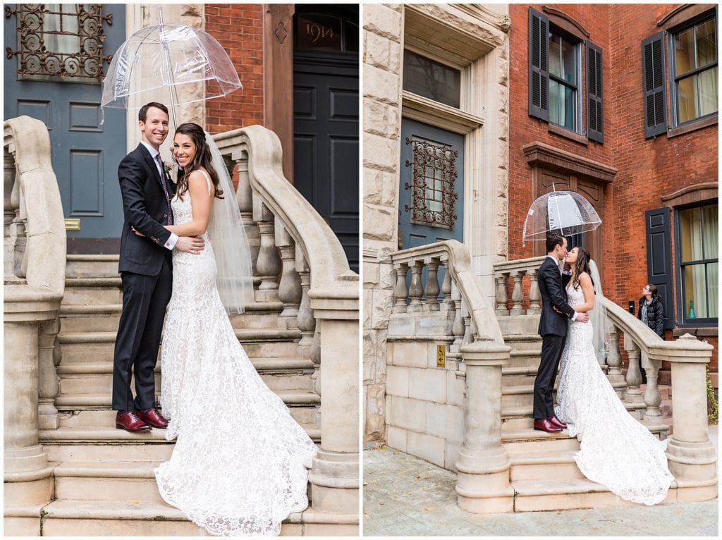 Bride and groom kiss under umbrella on Center City Philadelphia stairwell