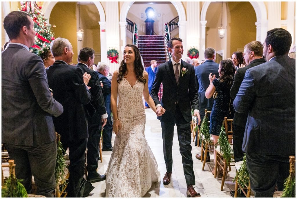 Bride and groom walk up aisle after wedding ceremony at Racquet Club of Philadelphia