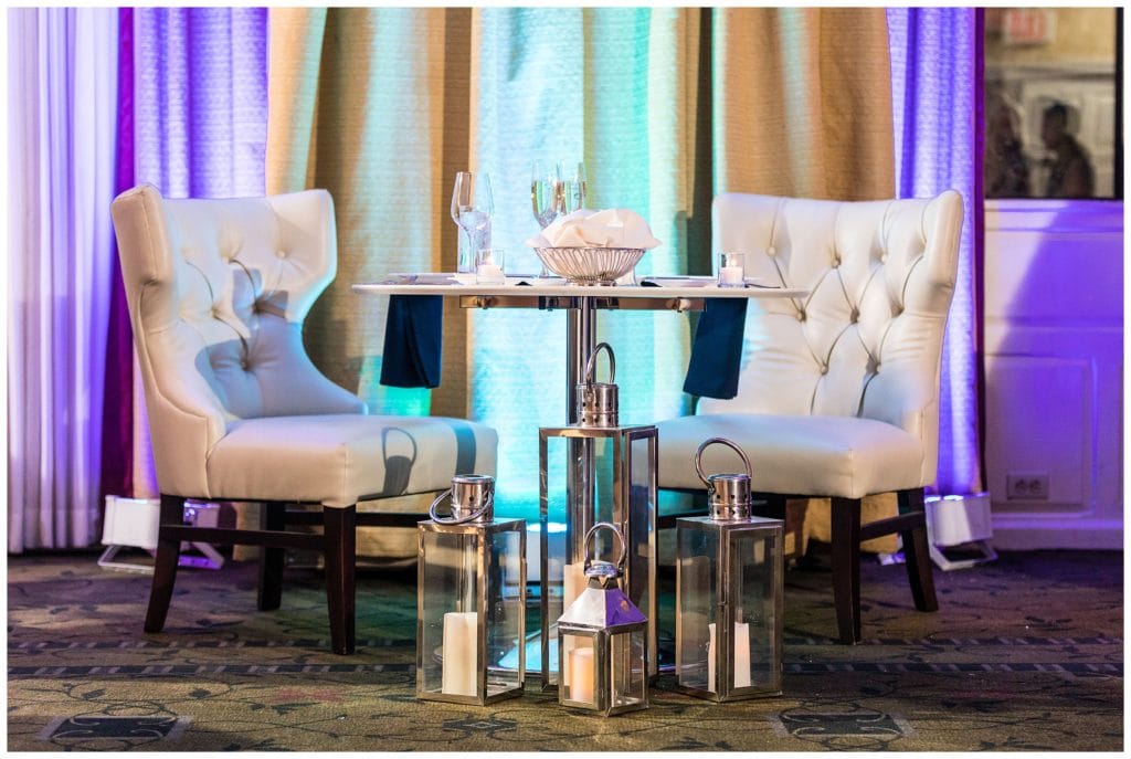 Sweetheart table with candle lantern floor pieces at Radnor Hotel winter wedding