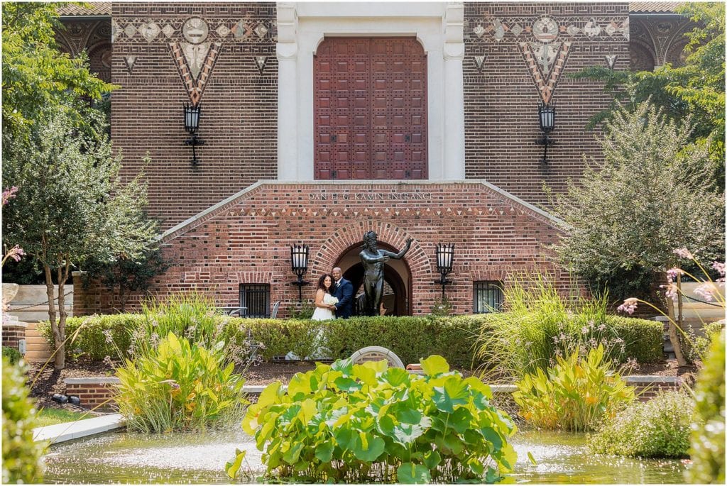 Traditional bride and groom wedding portrait in Penn Museum garden courtyard at intimate micro wedding