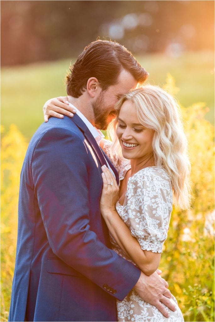 PHL17 Anchor sunset engagement photos in Valley Forge Park with fiancé holding her around the waist