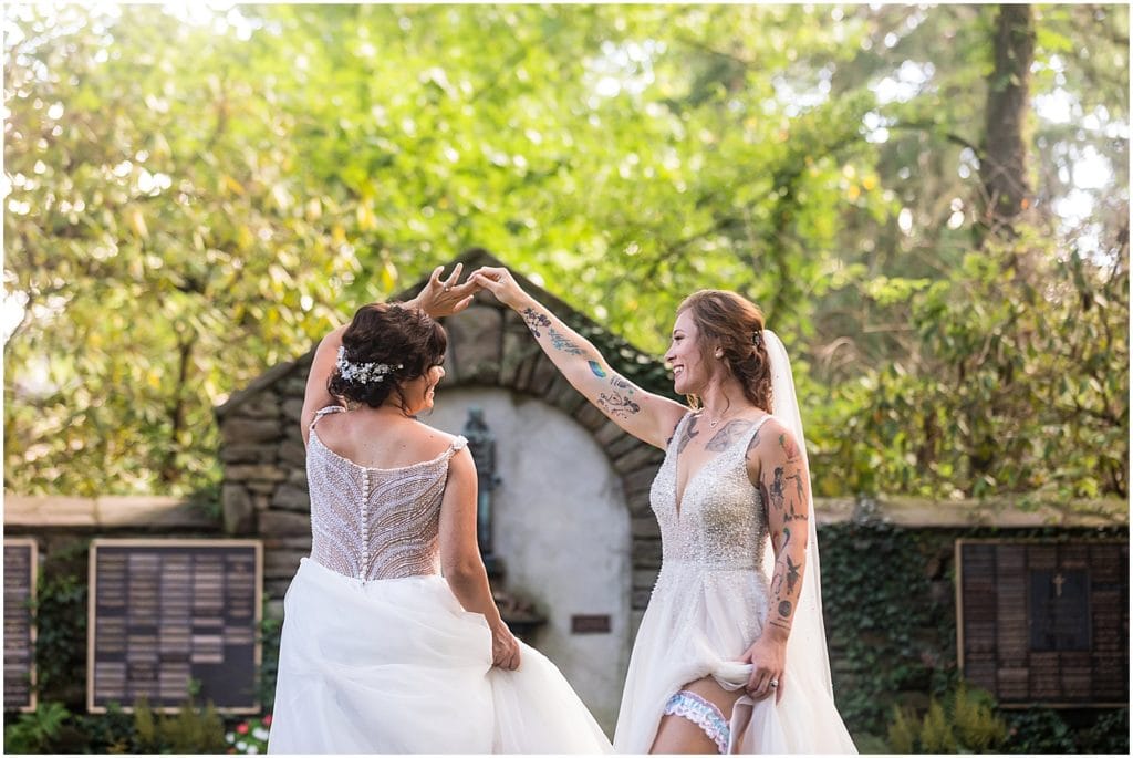 Bride spinning bride in tulle ballgown in Bolingbroke Mansion gardens