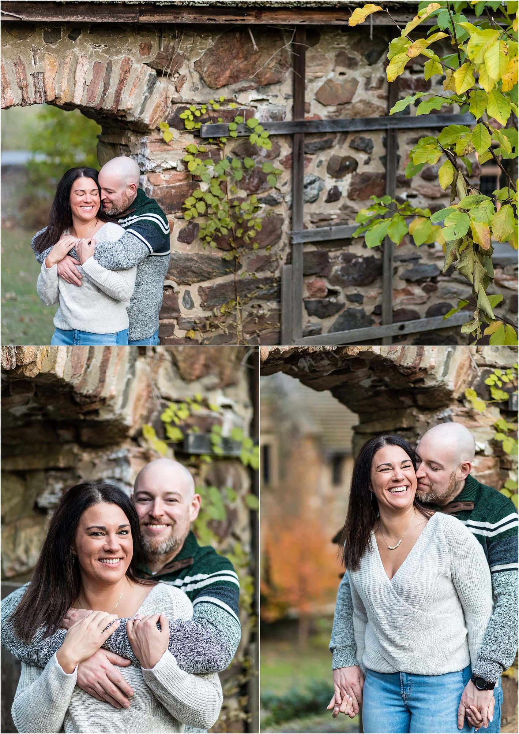 Couple hugging and laughing in stone wall archway at Ridley Creek engagement session