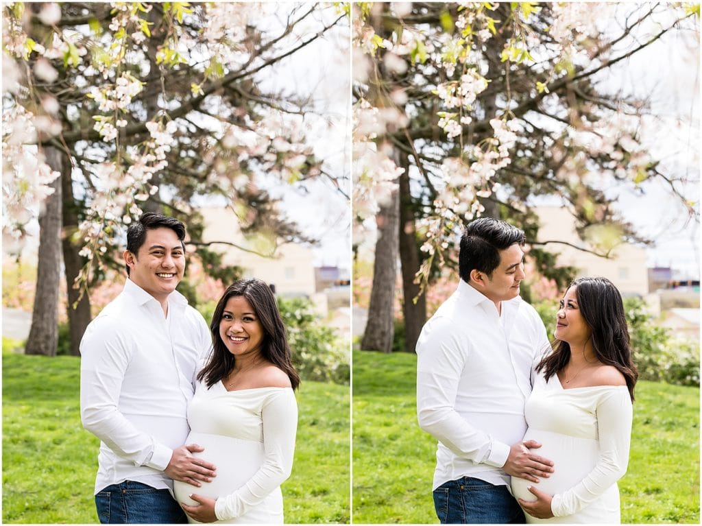 Maternity session portrait collage of husband and wife gazing at each other under white floral tree branches