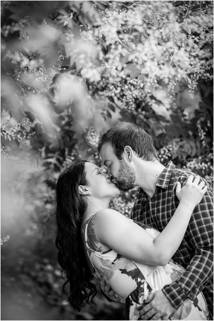 Couple dipping and kissing in a garden in Philadelphia