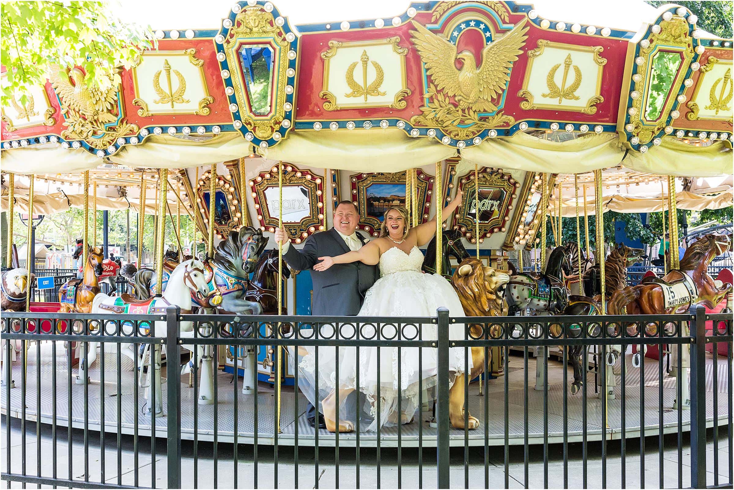 Bride and groom on carousel in Philadelphia