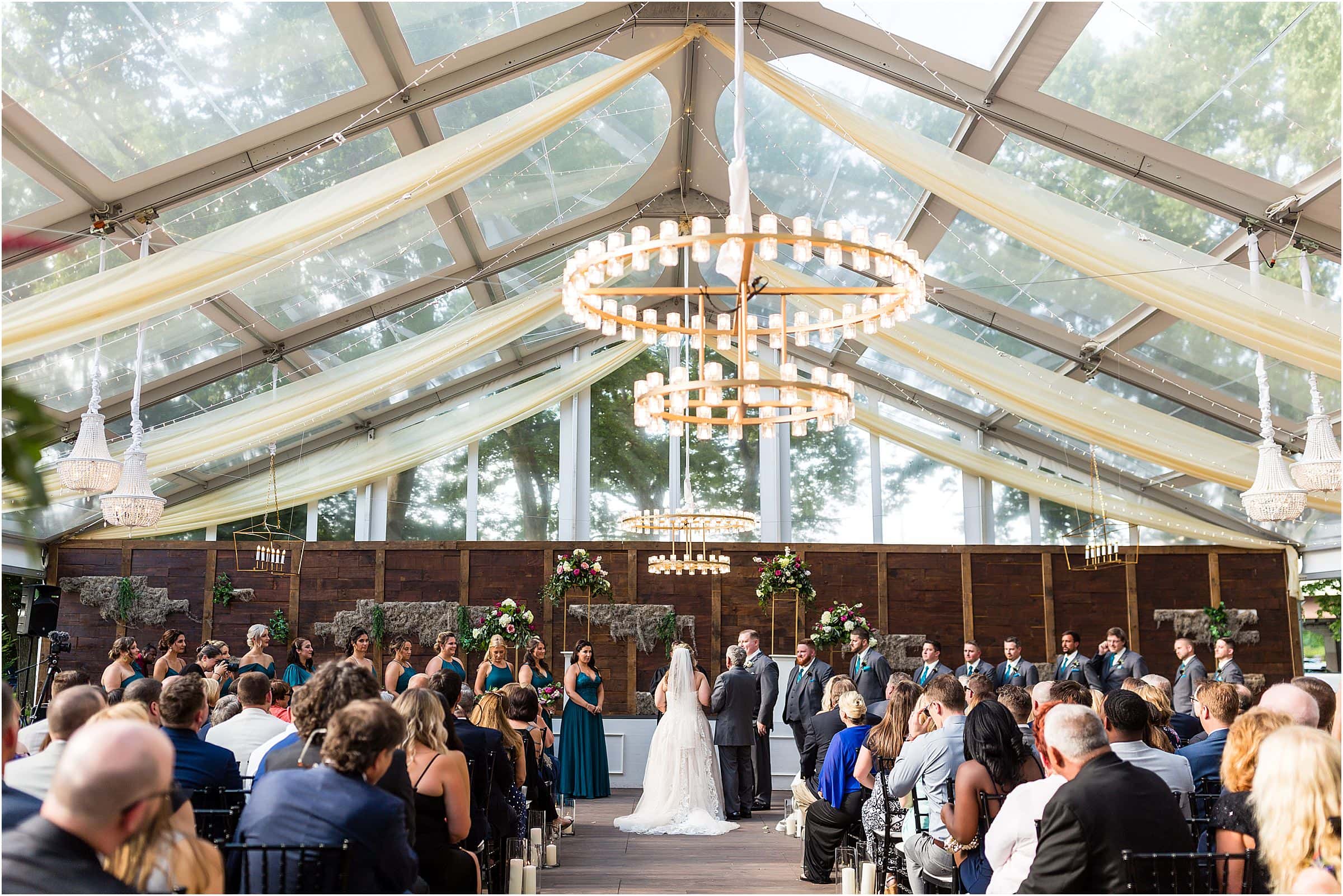 Bride and groom during their ceremony with bridal party