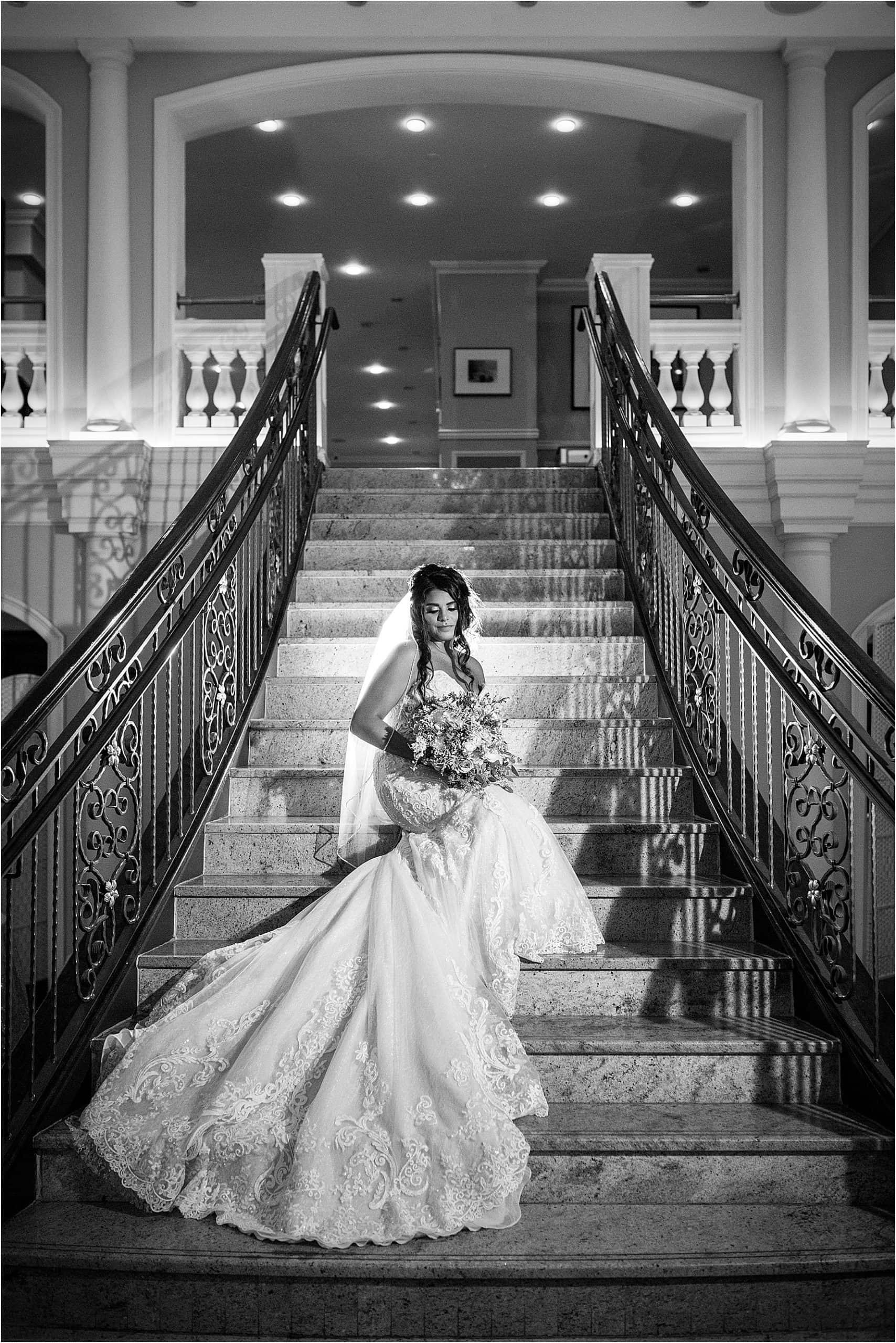 Bride on staircase black and white