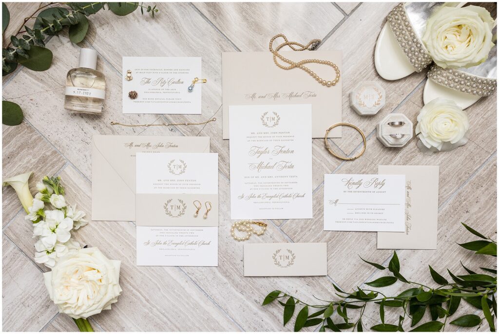 Cream, white, and gold classic invitation suite