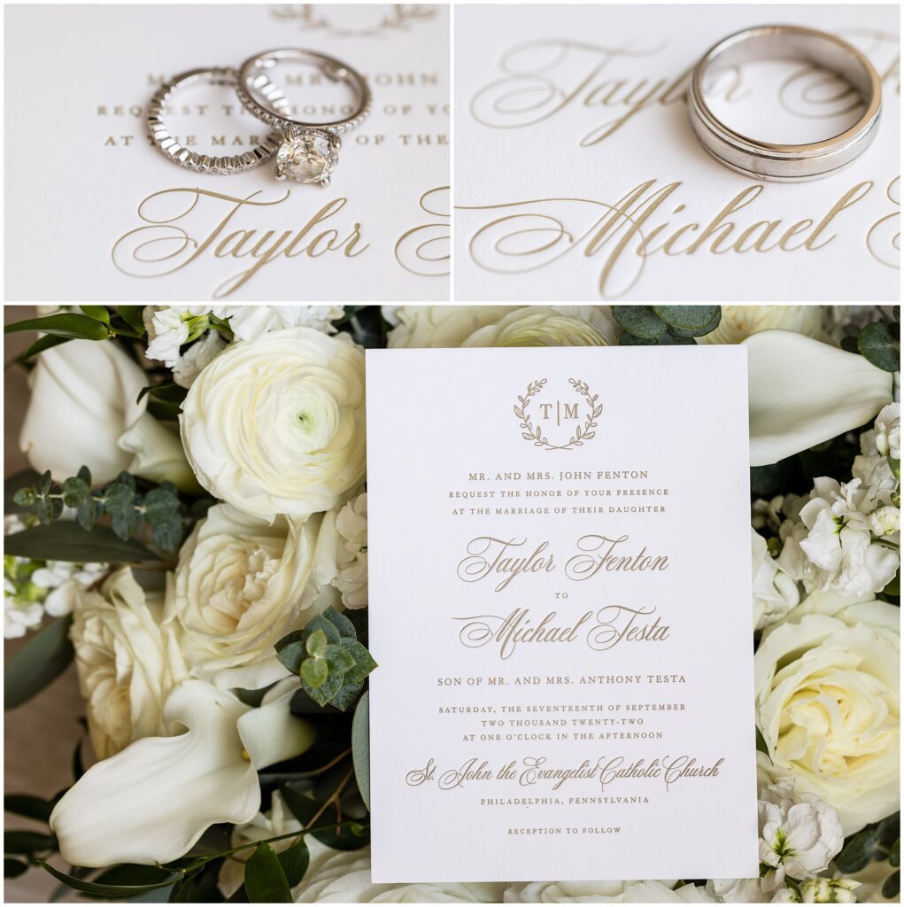 Wedding rings on top of white invitation with gold writing