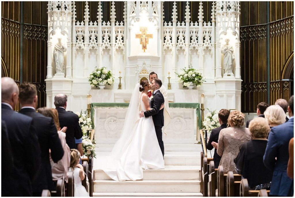 Newlywed's first kiss in their wedding ceremony