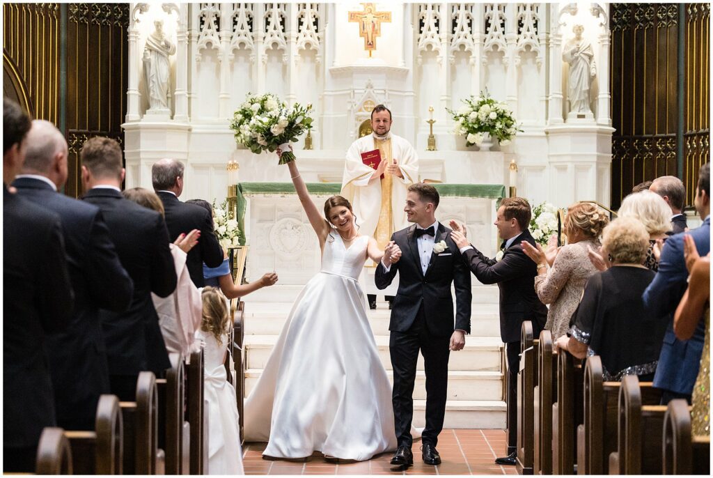 Newlyweds recessional inside St. John the Baptist Church